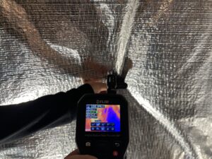 100% Reading of moisture retained by insulation behind moisture barrier